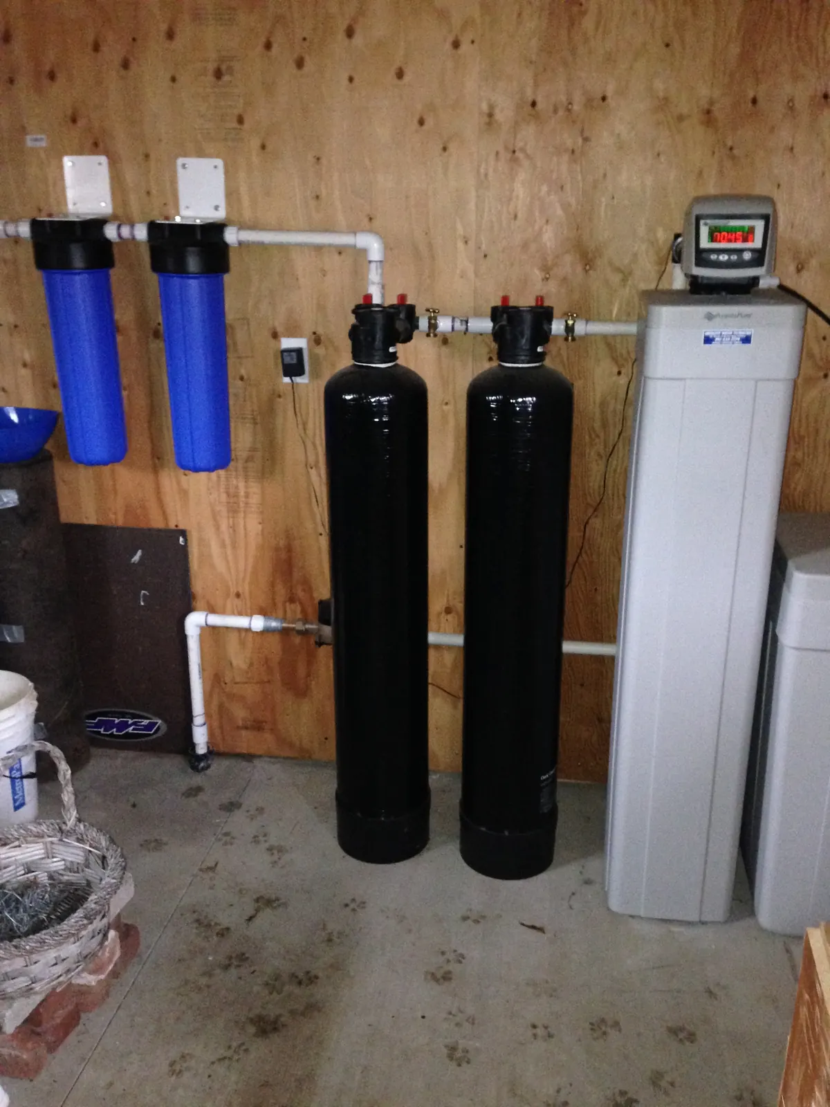 Dual media tanks with point-of-entry sediment cartridges.
