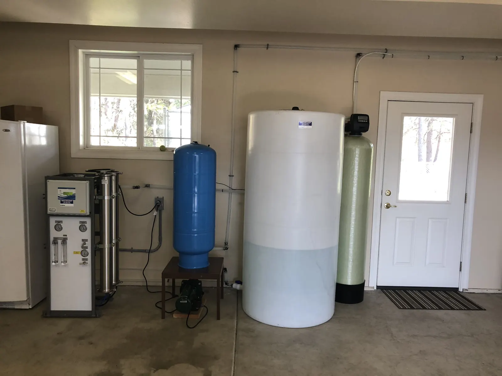 Garage install — RO skid, pressure tank, atmospheric storage, softener.