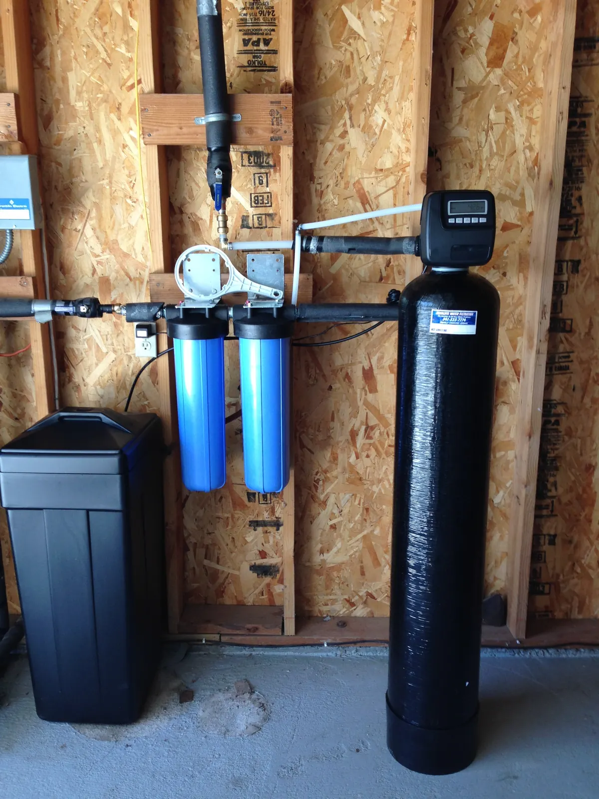Point-of-entry carbon tank with UV polish and sediment cartridges.